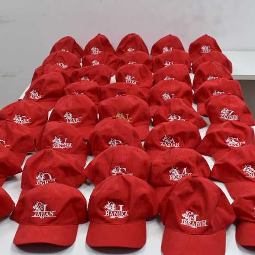 Customized embroidery work on caps
