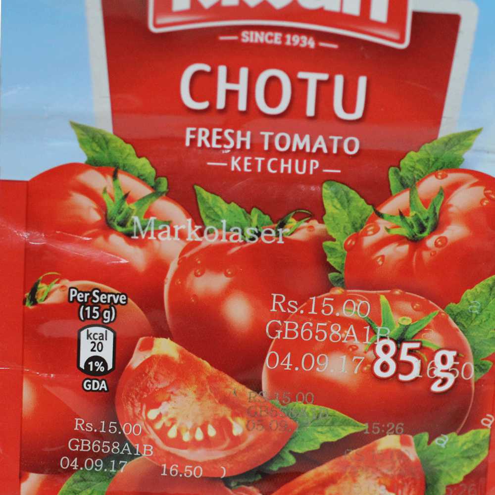 Laser marked bar code batch code and mrp patch on ketchup pack