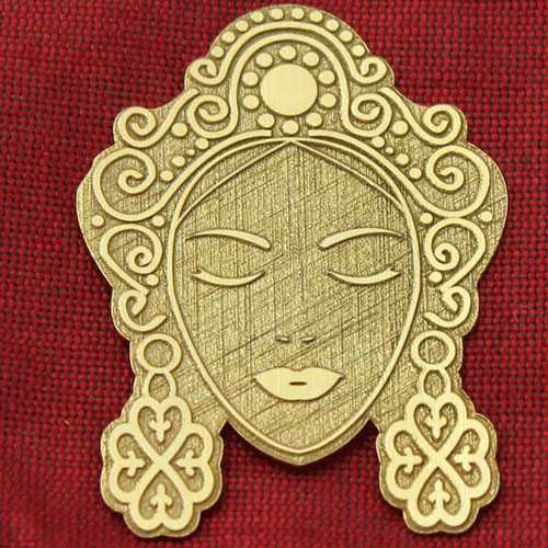 Laser marking and texturing on gold metal part