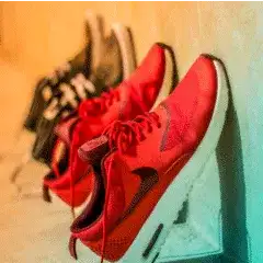  focus photography of pair of running shoes